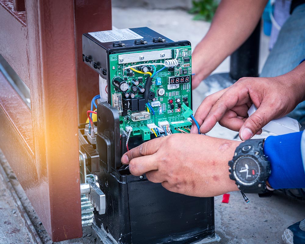 garage door technician installing garage door opener