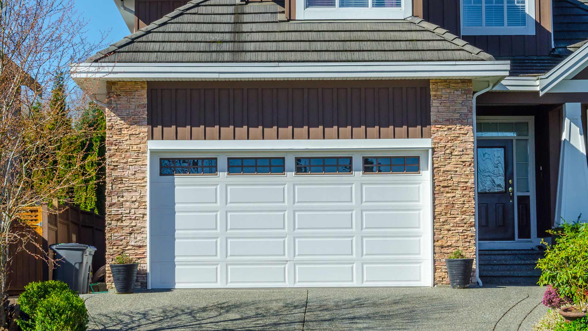 tan home white garage door